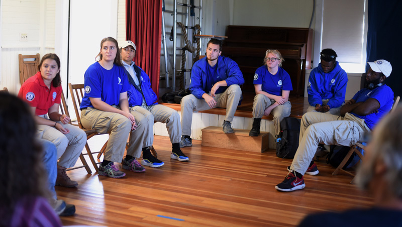 The "Summit 7" FEMA Corps group discusses commodity distribution sites with Monhegan officials in the Monhegan School, Monday, Aug. 20. (Jessica Picard photo)