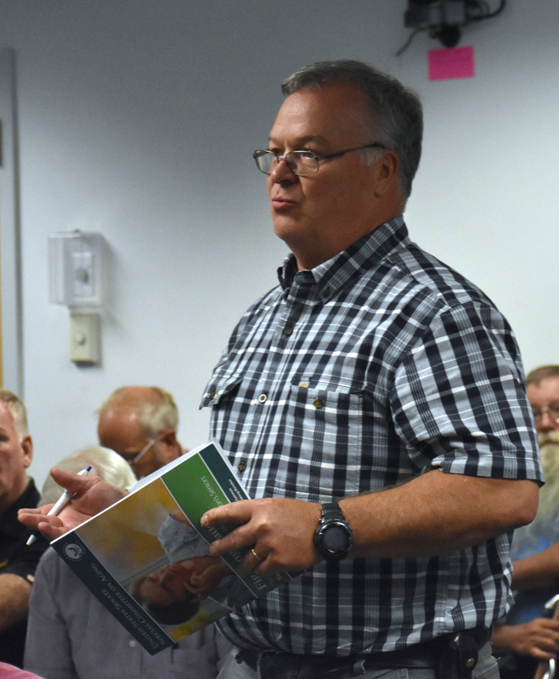 Waldoboro Deputy Fire Chief Dale Smith discusses the benefits of a new ladder truck, including the ability to rescue someone in the upper stories of a tall building. (Alexander Violo photo)