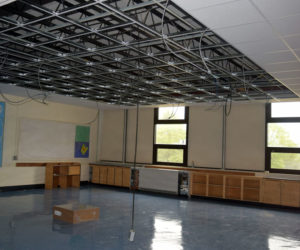 Drop ceilings are being added to 13 rooms on the east side of Wiscasset Middle High School to mount new light fixtures that will support LED bulbs. (Jessica Clifford photo)