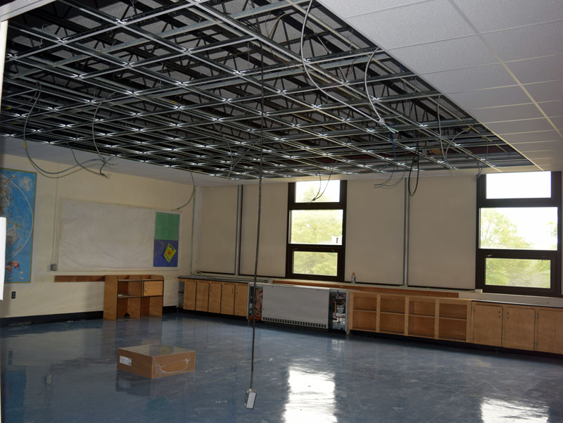 Suspended ceilings are being added to 13 rooms on the east side of Wiscasset High School to install new light fixtures that will support LED bulbs.  (Photo by Jessica Clifford)
