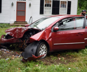 The scene of a car crash involving a Nissan Sentra on Bristol Road in Damariscotta, Tuesday, Sept. 25. Police said the Sentra struck another car, then went off the road and struck a tree in the area of 199 Bristol Road. (Jessica Picard photo)