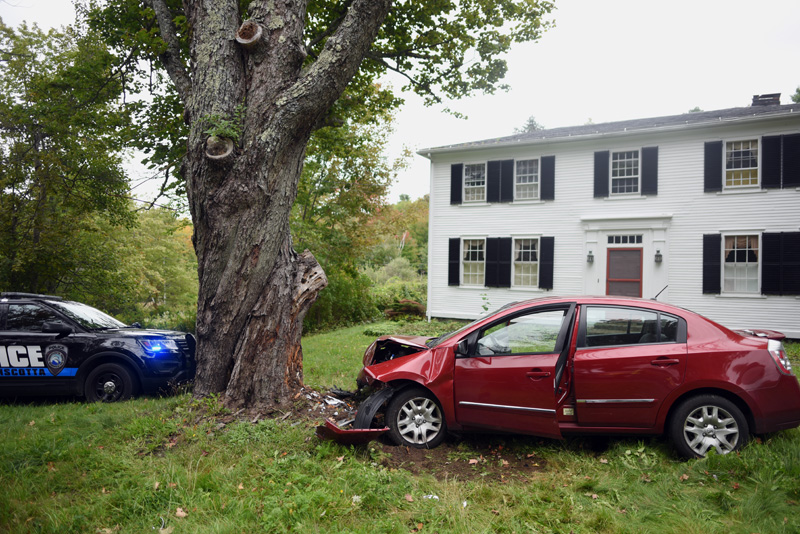 A Nissan Sentra struck another car, then left the road and struck a large tree on Bristol Road in Damariscotta, Tuesday, Sept. 25. (Jessica Picard photo)