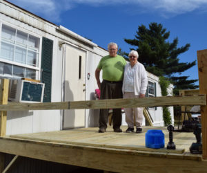 Anna and Rex Bickford, of Waldoboro, stand on the new deck of their Waldoboro home Saturday, Sept. 8. Volunteers built the deck and a ramp on CHIP Inc.'s Community Cares Day. (Jessica Clifford photo)