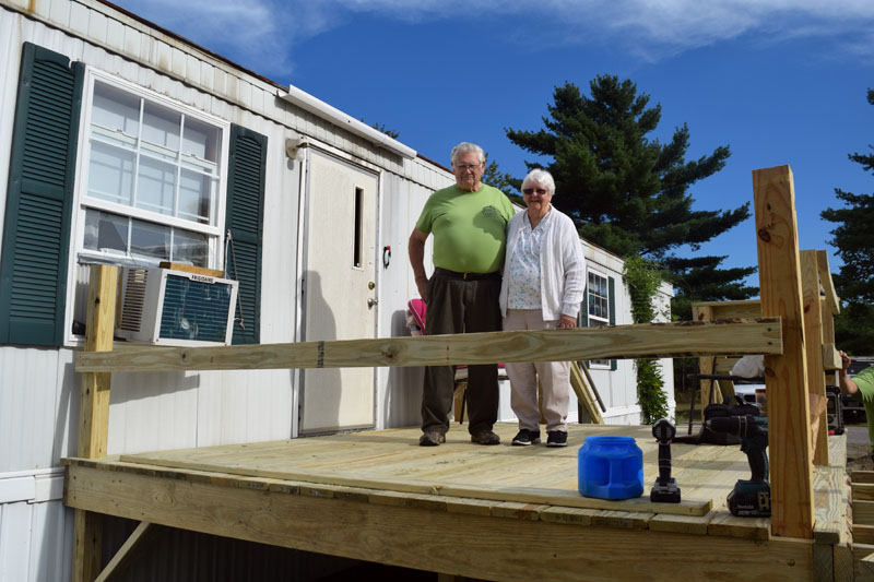 Anna and Rex Bickford, of Waldoboro, stand on the new deck of their Waldoboro home Saturday, Sept. 8. Volunteers built the deck and a ramp on CHIP Inc.'s Community Cares Day. (Jessica Clifford photo)