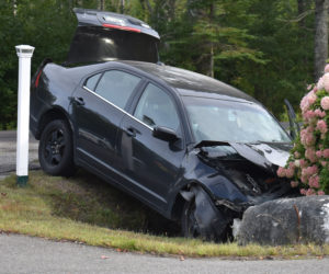 A Ford sedan was one of three vehicles involved in a collision in Waldoboro that sent four people to the hospital on the afternoon of Wednesday, Sept. 12. (Alexander Violo photo)