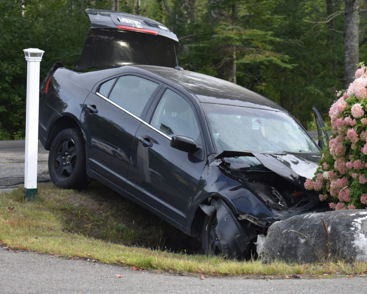 A Ford sedan was one of three vehicles involved in a collision in Waldoboro that sent four people to the hospital on the afternoon of Wednesday, Sept. 12. (Alexander Violo photo)