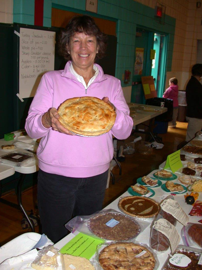 At AppleFest, on Oct. 13, there will be lots of fresh, homemade apple pies like the one AppleFest volunteer Carolyn Hardman is holding in front of the food table.