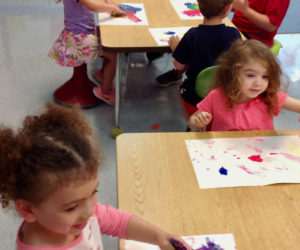Kindergarten students at Nobleboro Central School try their hand at finger painting.