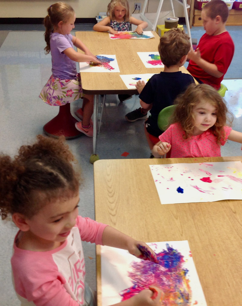 Kindergarten students at Nobleboro Central School try their hand at finger painting.