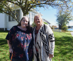 Carolyn Mattern (left) and Liz Michaud stand in front of what was once their great-grandparents' home in Round Pond on Oct. 5. (Jessica Picard photo)