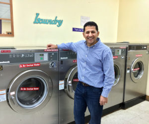 Majed Awamleh and his wife, Elizabeth, bought Tri Bay Laundry in Damariscotta, along with the four-unit building that houses the laundromat, July 18. (Suzi Thayer photo)