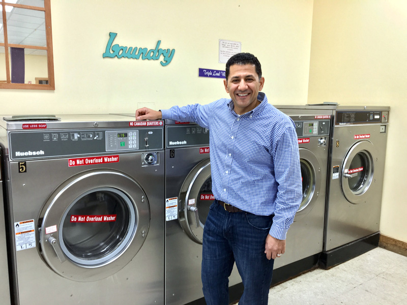 Majed Awamleh and his wife, Elizabeth, bought Tri Bay Laundry in Damariscotta, along with the four-unit building that houses the laundromat, July 18. (Suzi Thayer photo)