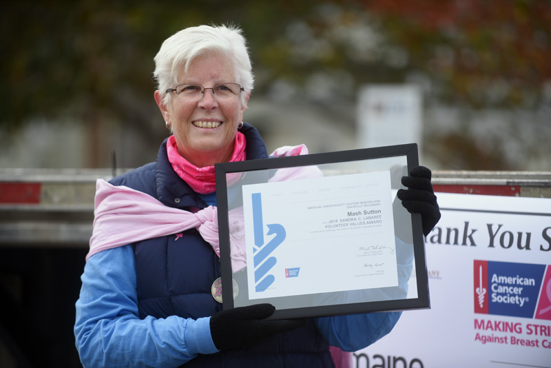 Breast cancer survivor Mash Sutton, of Damariscotta and Florida, holds the Sandra C. Labaree Volunteer Values Award, which she received during the Making Strides Against Breast Cancer event Sunday, Oct. 21. (Jessica Picard photo)