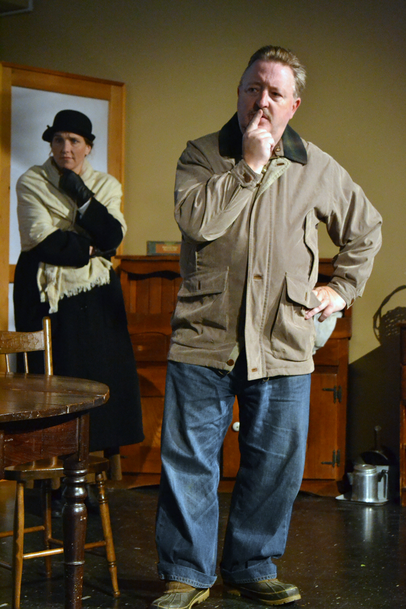 Heather Richard, as Mrs. Hale, and Mitchell Wellman, as Mr. Hale, ponder the mysterious situation at hand in the one-act play "Trifles," presented by River Company. (Christine LaPado-Breglia photo)