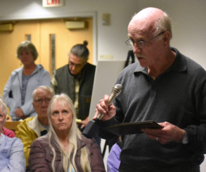 Dewey Meteer, of Nobleboro, asks a question about early childhood education during a candidates forum at the Waldoboro municipal building Thursday, Oct. 11. (Alexander Violo photo)