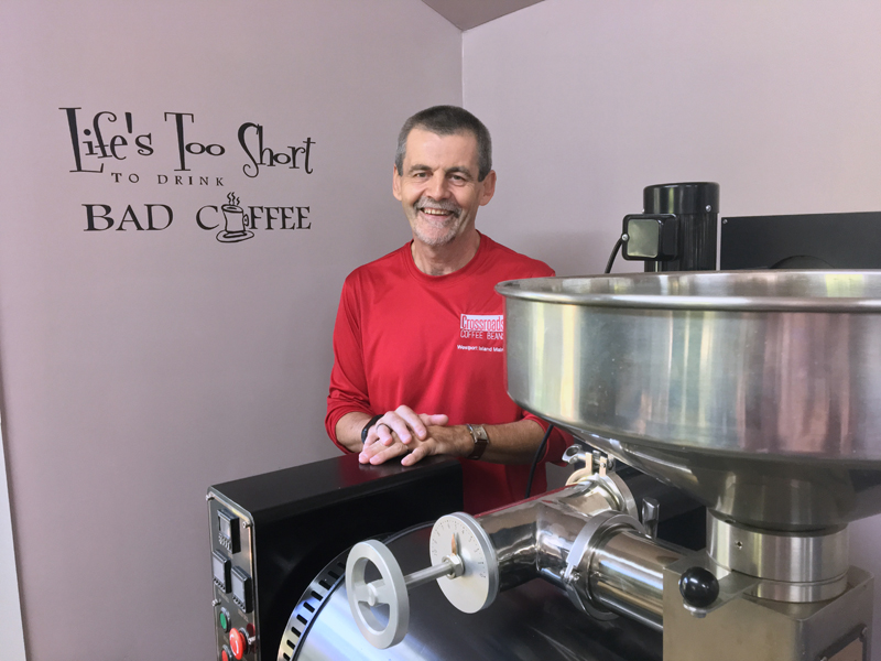 Steve Arsenault at his coffee-roasting business, Crossroads Coffee Beans, on Westport Island. The writing on the wall says "Life's too short to drink bad coffee." (Suzi Thayer photo)