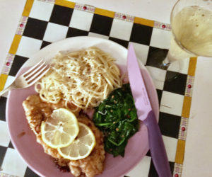Chicken frances with sauteed spinach and cacio a pepe, and a glass of prosecco, made for a sublime meal. (Suzi Thayer photo)