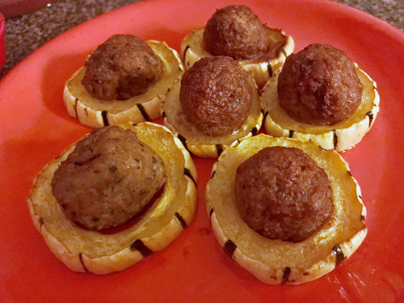 Delicata squash with balls on a bright orange melamine plate. (Suzi Thayer photo)