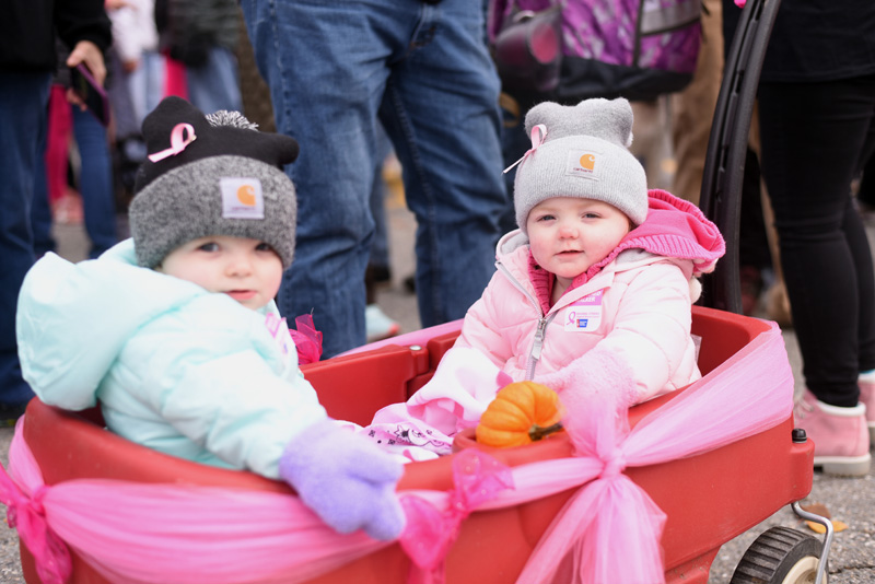 Lorelei (left) and Charlie Barrows, 14-month-old twins, ride in a wagon during the Making Strides Against Breast Cancer walk Sunday, Oct. 21. The twins' great aunt was recently diagnosed with breast cancer, and the family walked to support her. (Jessica Picard photo)