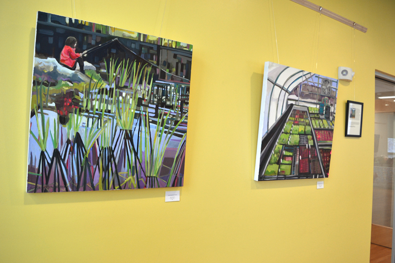 Susan Bartlett Rice's paintings "Girl Fishing" (left) and "Greenhouse Greens" greet one upon entrance into the lobby at the Central Lincoln County YMCA. (Christine LaPado-Breglia photo)
