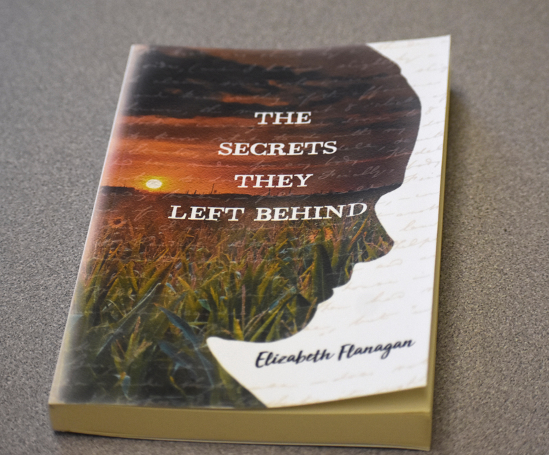 The cover of Elizabeth Flanagan's first novel, "The Secrets they Left Behind." (Alexander Violo photo)