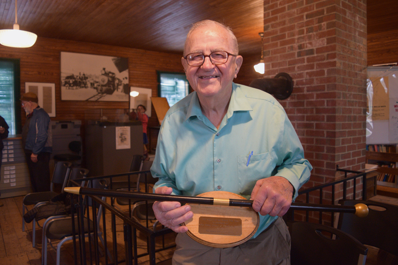 Albert Boynton holds a replica of Whitefield's Boston Post Cane. Boynton, 92, holds the cane as the town's oldest resident. (Jessica Clifford photo)