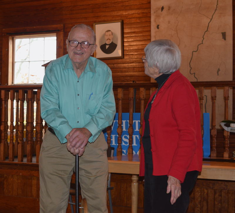 Albert Boynton leans on a replica of Whitefield's Boston Post Cane as Marie Sacks looks on during a ceremony at the Whitefield Historical Society on Saturday, Nov. 3. (Jessica Clifford photo)