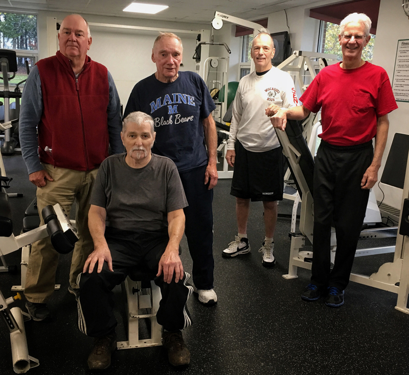 A small group of men, four of the five cancer patients or survivors, gathers at the Wiscasset Community Center several times a week to work out and support one another. From left: Bob Summers, Dan Plummer (seated), Phil Withee, Chuck Shea, and Glenn Milley. (Photo courtesy Katrina Willey)