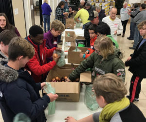 The Ecumenical Food Pantry in Newcastle coordinates the preparation of Thanksgiving food baskets.