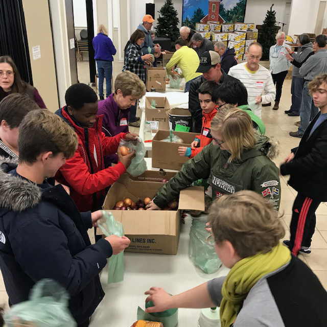 The Ecumenical Food Pantry in Newcastle coordinates the preparation of Thanksgiving food baskets.