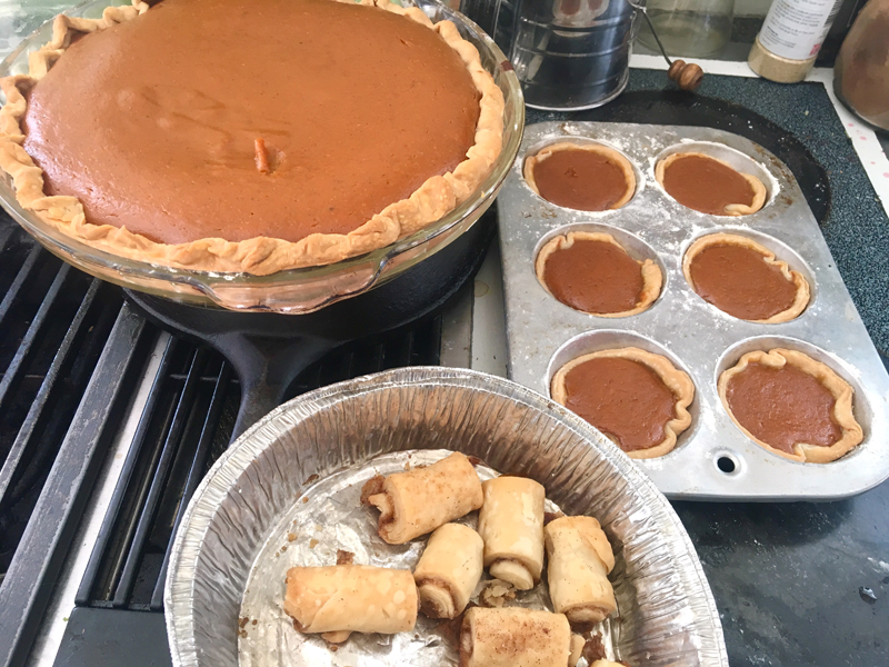 A pumpkin pie and some of its offspring: pumpkin cuppies and cinnamon rolls. (Suzi Thayer photo)
