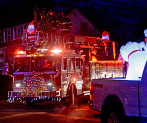 Polar bears watch the Damariscotta Fire Department ladder truck during the 2017 Villages of Light parade. (Paula Roberts photo, LCN file)