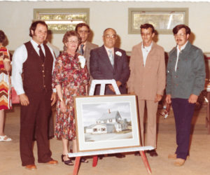 From left: (front row) Jerry Farrin, Gail Poole, Carl Poole Sr., and Carl Poole Jr.; and (back row) Craig Leeman and Gordon Bailey at the announcement of the new showroom addition (shown on easel) at Pemaquid Falls.