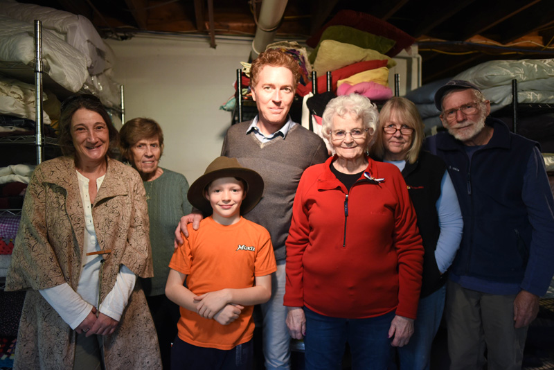 Some of the volunteers at People to People on Monday, Dec. 3. From left: Sue Robbins, Hope Durkee, Atticus Donaghy, Aaron Donaghy, Shirley Tibbetts, Judy Higgins, and Steve Higgins. (Jessica Picard photo)