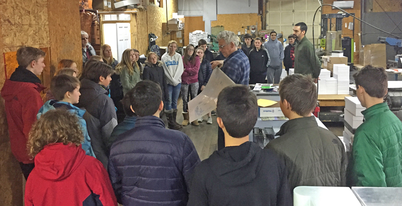 Chris Roberts, publisher of The Lincoln County News, explains the printing process to Great Salt Bay Community School eighth-graders during their tour of the Lincoln County Publishing Co. plant in Newcastle.