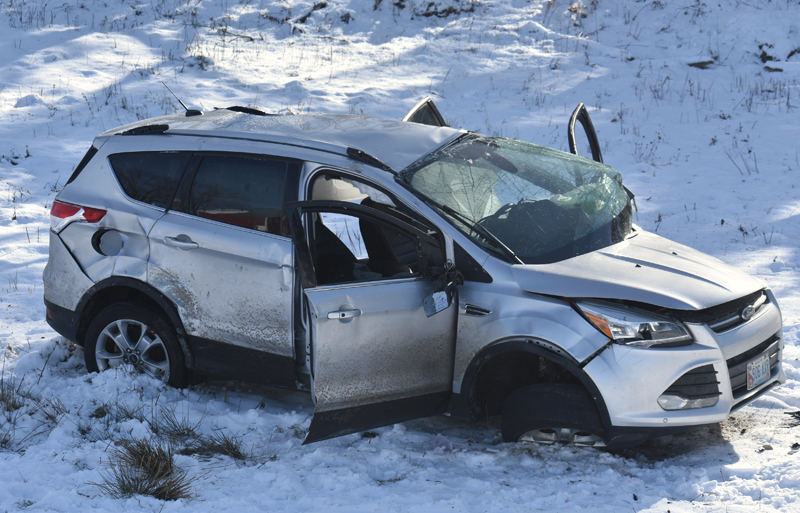 A 2014 Ford Escape SUV shows heavy damage after rolling over and down an embankment on East Pond Road in Nobleboro the morning of Tuesday, Dec. 18. (Alexander Violo photo)