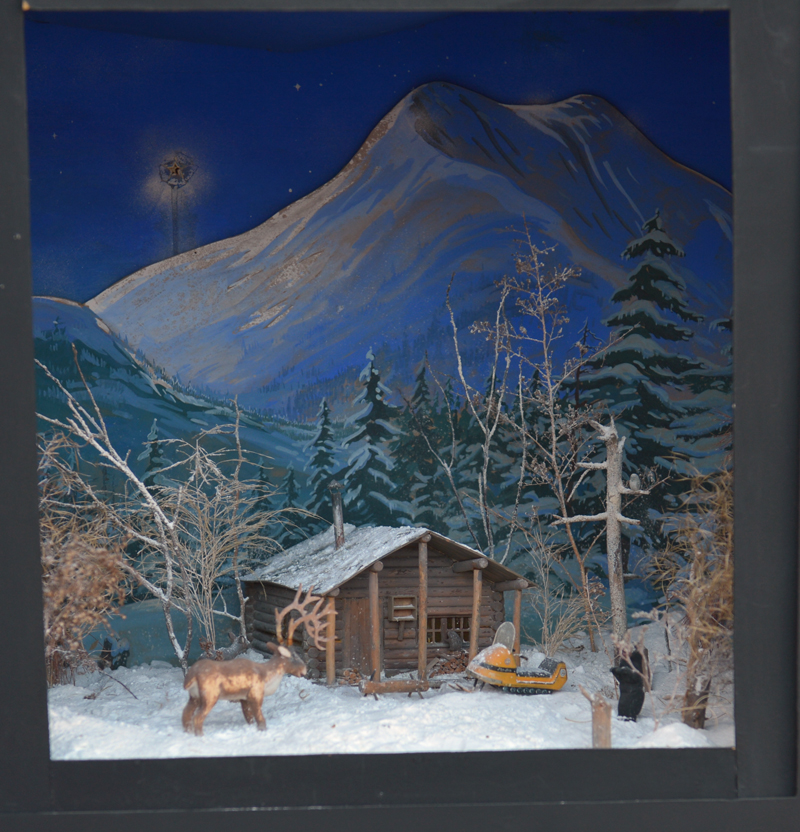 A cabin in the woods scene is one of Jake Day's dioramas on display at Milling Around in Newcastle through Jan. 5.