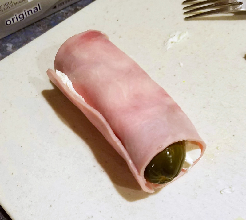One of Kathy Lizotte's famous ham, pickle, and cream cheese rolls, before slicing. (Photo courtesy Kathy Lizotte)