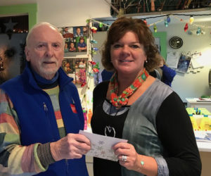Bristol Area Lion Bill Byrnes presents the Bristol Area Lions Foundation donation to Caring for Kids President and Executive Director Jenny Pendleton. (Photo courtesy Pat Byrnes)