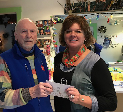 Bristol Area Lion Bill Byrnes presents the Bristol Area Lions Foundation donation to Caring for Kids President and Executive Director Jenny Pendleton. (Photo courtesy Pat Byrnes)