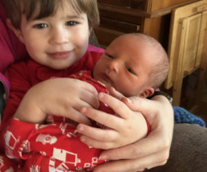 Thomas Sutter holds his little brother, Emmett Brice Sutter.