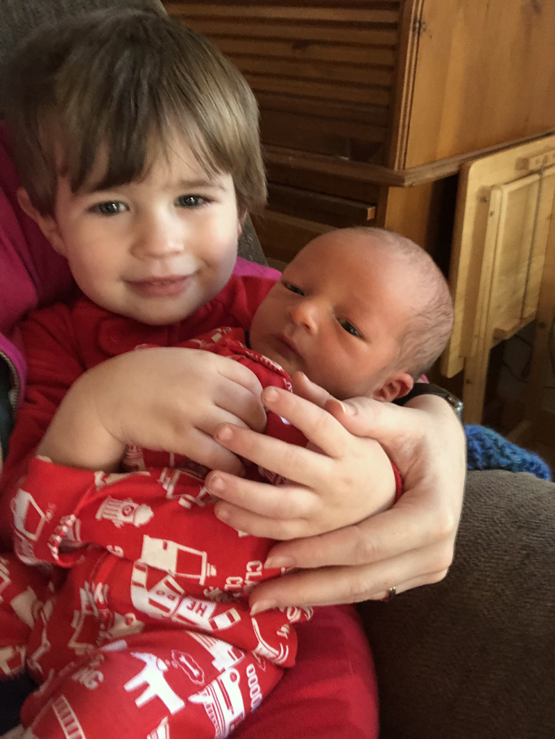 Thomas Sutter holds his little brother, Emmett Brice Sutter.