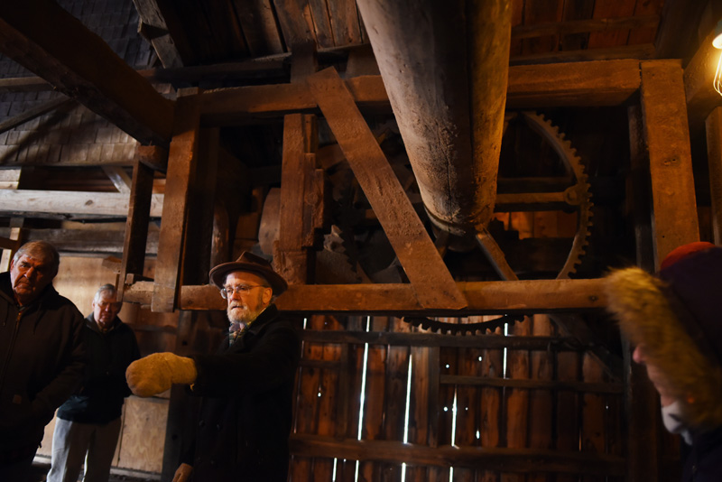 Phil Averill shows a tour group equipment from the 1800s-era Pemaquid Mill during a tour of the building Thursday, Jan. 17. (Jessica Picard photo)