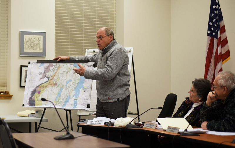 Damariscotta Town Manager Matt Lutkus uses a map to point out the town's zoning districts during a community conversation about marijuana ordinances Wednesday, Jan. 2. (Jessica Picard photo)