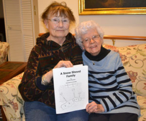 Damariscotta artist Julie Babb (left) and Newcastle writer Ruth Knowles with Knowles' new children's book, "A Snow Shovel Family," illustrated by Babb. (Christine LaPado-Breglia photo)