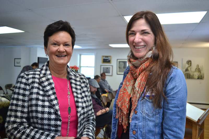 Julie Richard (left), executive director of the Maine Arts Commission, chats with Emily Peckham, director of development at Points North Institute in Rockland, at the 2019 Maine Arts Iditarod on Wednesday, Jan. 16 at River Arts in Damariscotta. (Christine LaPado-Breglia photo)