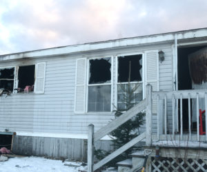 Exterior damage to a mobile home at 139 Old Sheepscot Road after a fire the morning of Wednesday, Jan. 16. (Jessica Clifford photo)