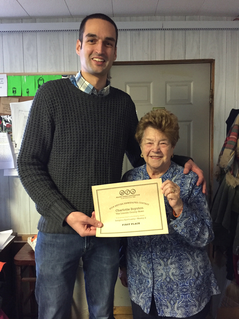 Charlotte Boynton accepts a certificate for first place in the Religion/Spirituality Story category of the 2018 Maine Press Association Better Newspaper Contest from J.W. Oliver. At 86, Boynton may be the oldest active newspaper reporter in Maine.