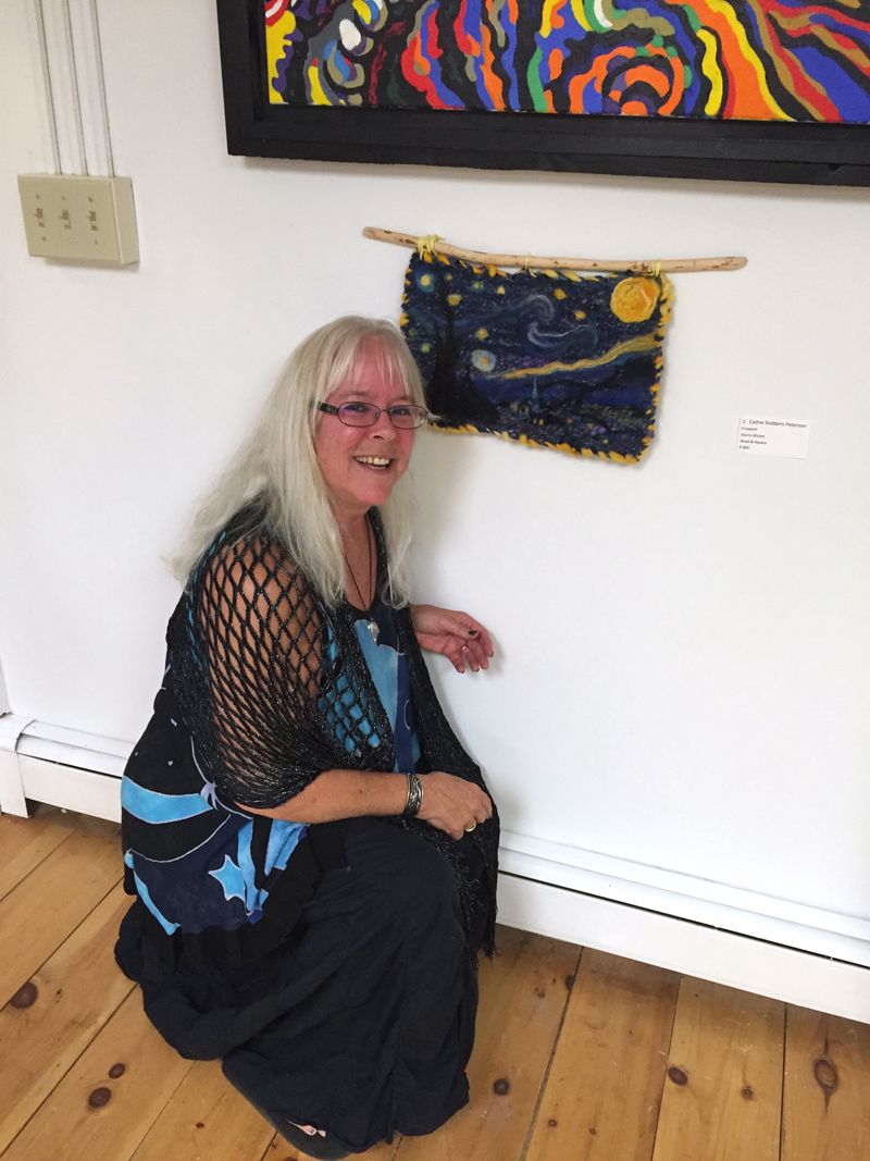 Cathie Stebbins Peterson and her Â“Starry NightÂ” wall hanging inspired by Vincent van Gogh's iconic painting Â“The Starry Night.Â” It is unframed and hangs from a Â“beaver stick,Â” as Peterson calls it.