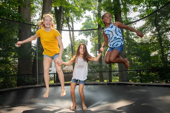 Treasure, from Brooklyn, N.Y., enjoys a beautiful day with her summer sisters, Caroline and Isabelle. (Photo courtesy Alex Steedman)